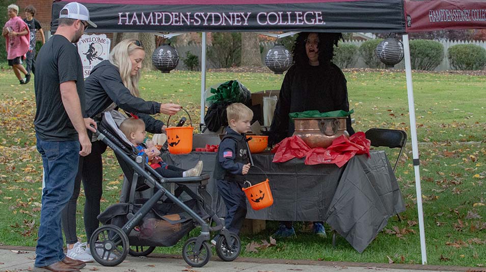 parents and children trick or treating on Via Sacra on Halloween 