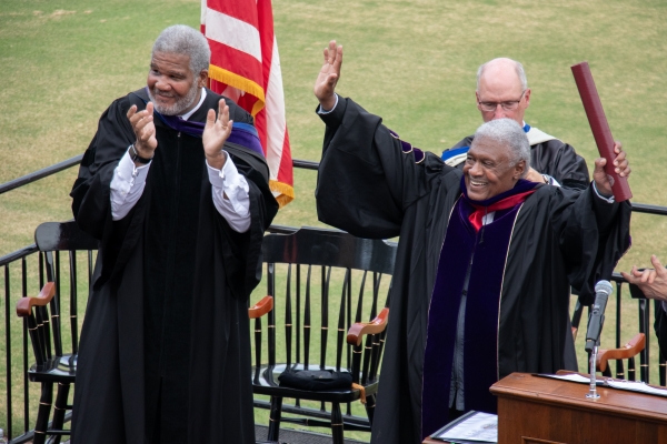 Justice John Thomas standing in front of the HSC student body