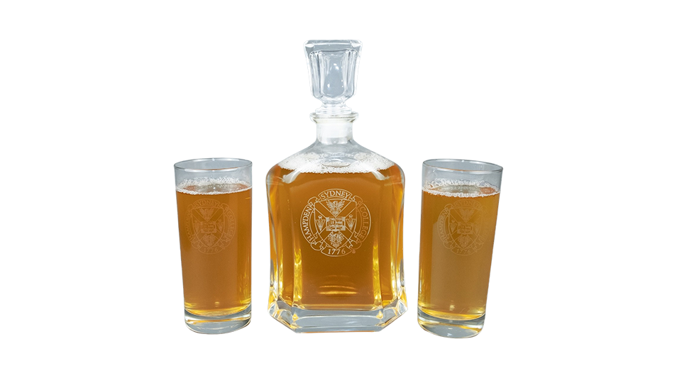 a photo of glass carafe and two glass tumblers with beer in them