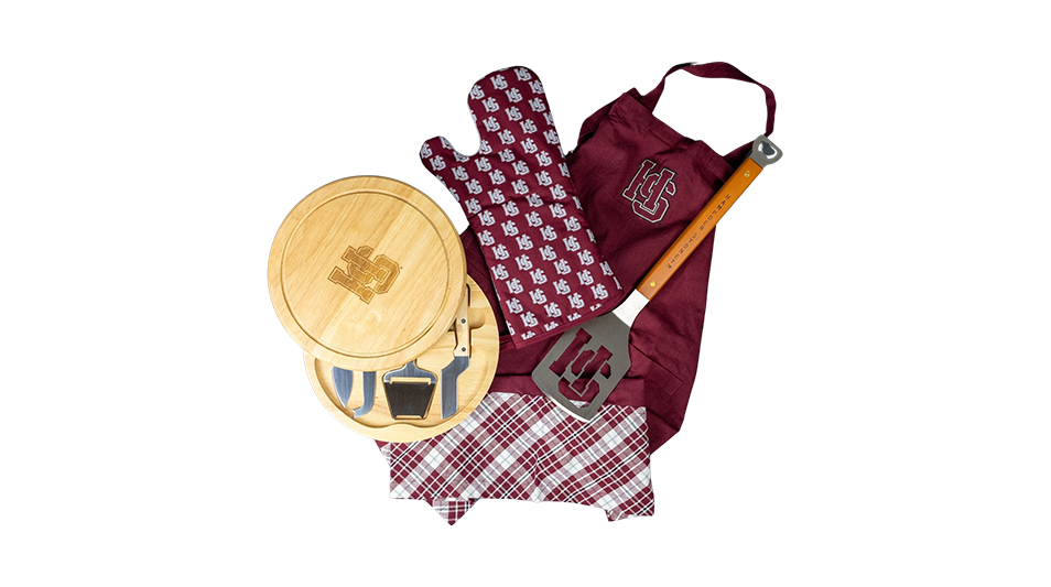 a photo of a Hampden-Sydney College grilling mitt, spatula, apron, and cutting boards