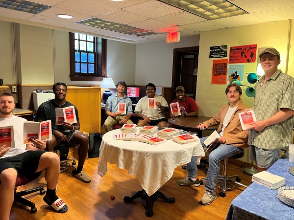 Hampden-Sydney students holding copies of newly published The Garnet literary magazine