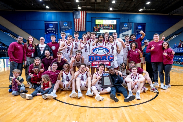 Tiger basketball players and coaches posing for a photo