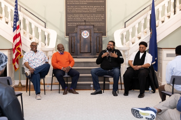 Alumni sitting in front of a group at the 2025 MAM Weekend reunion