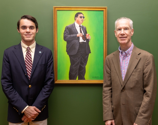 Dr. Werth and Owen Kahn ’27 standing next to Brinkley's portrait