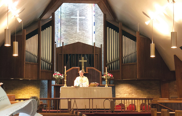a priest at the pulpit at church