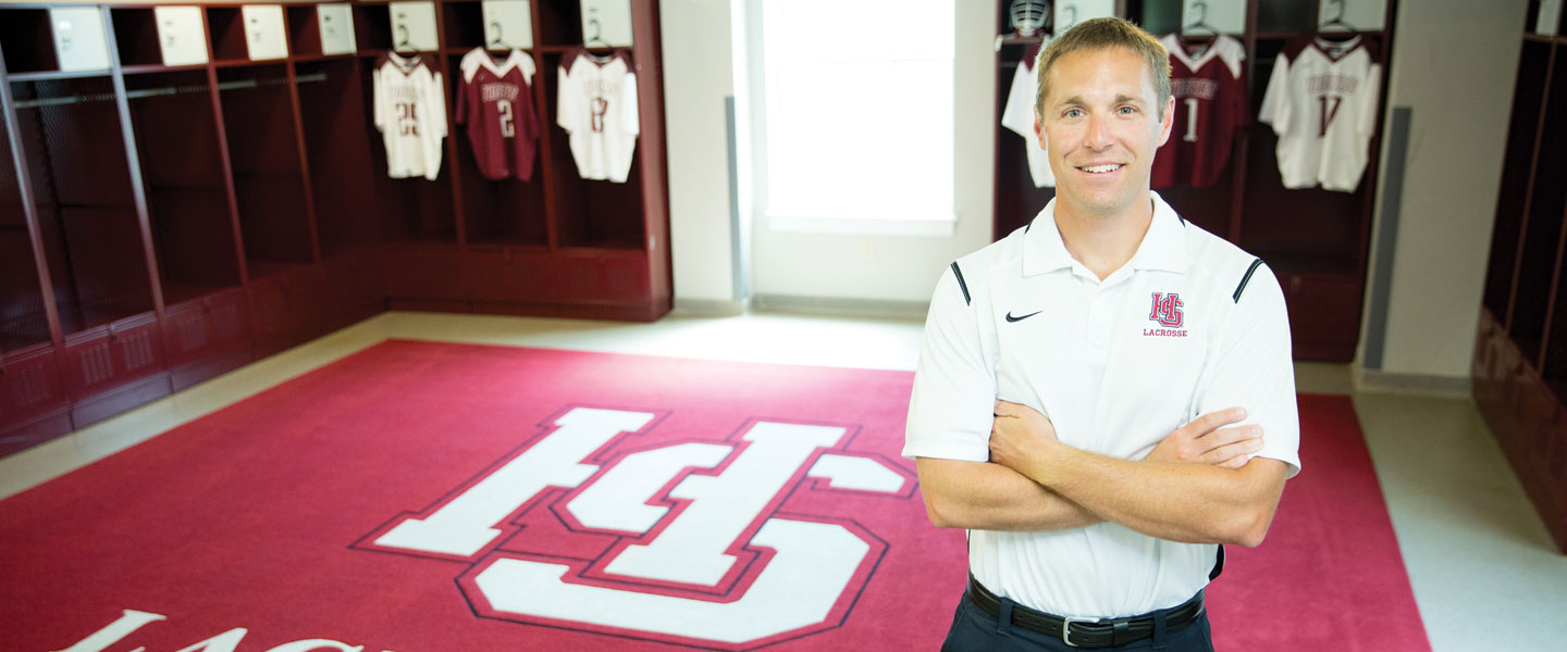 Jay Rostan '03, H-SC lacrosse coach, in the locker room