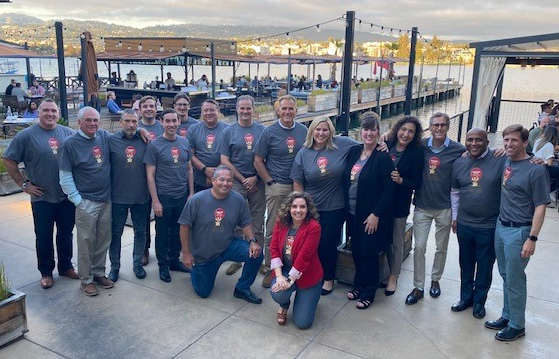 Eric Lindberg and company employees pose for a photo