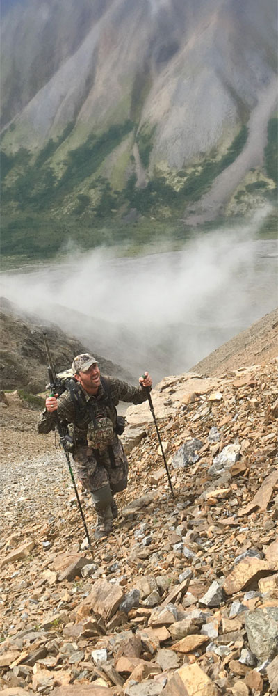 Michael Luter '94 climbing a mountain