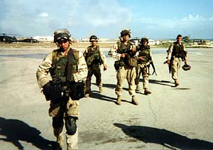 Soldiers on location in combat gear