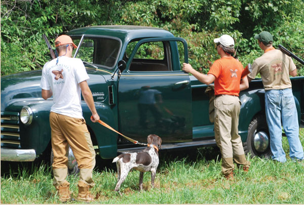 Demas Boudreaux at a truck with friends