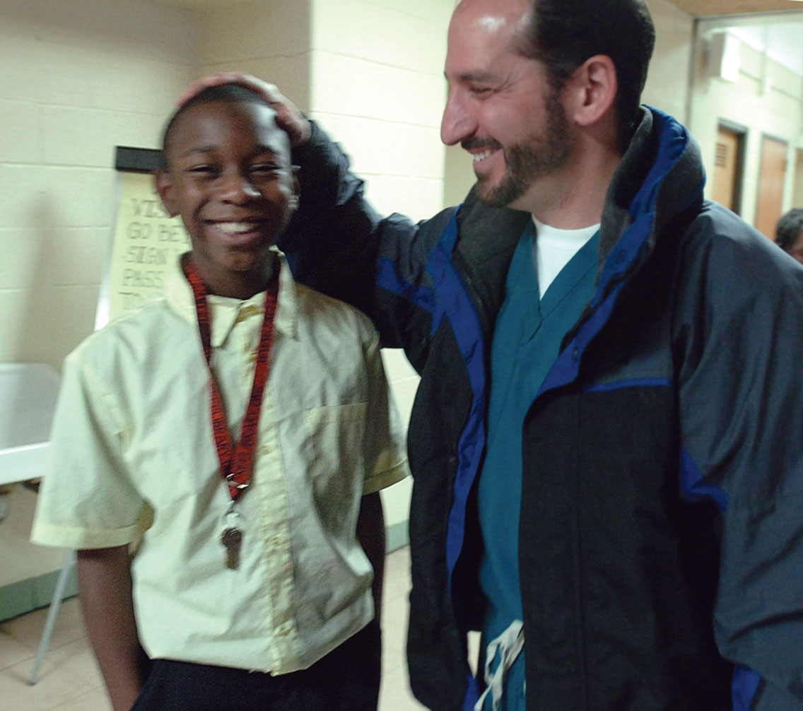 Dr. Larry Caplin, with a child