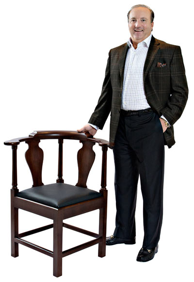 Owen Suter '81 with replica of Patrick Henry's corner chai