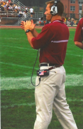 Coach Ryan Silverfield standing on the sideline coaching a football game