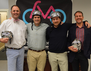 Scott Keel '02 and frinds wearing bike helmets