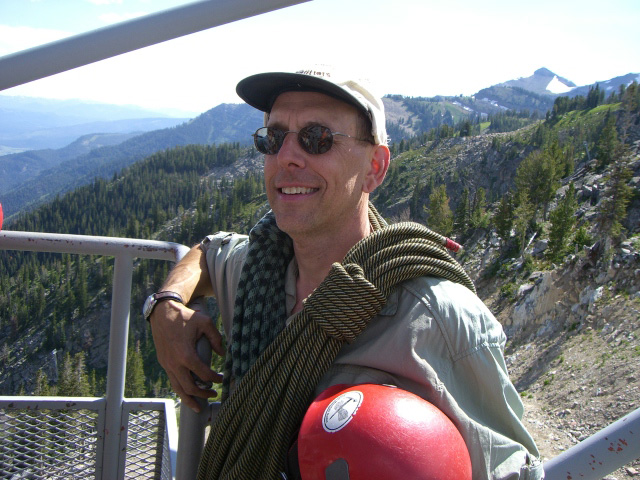 Paul Brown standing in front of a mountain calley