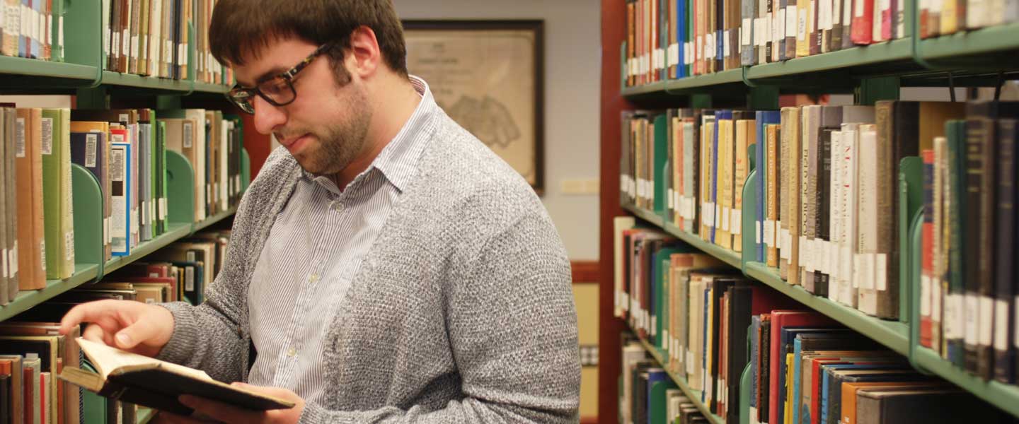 Dalton Hall '19 reading in the Bortz Library at Hampden-Sydney College