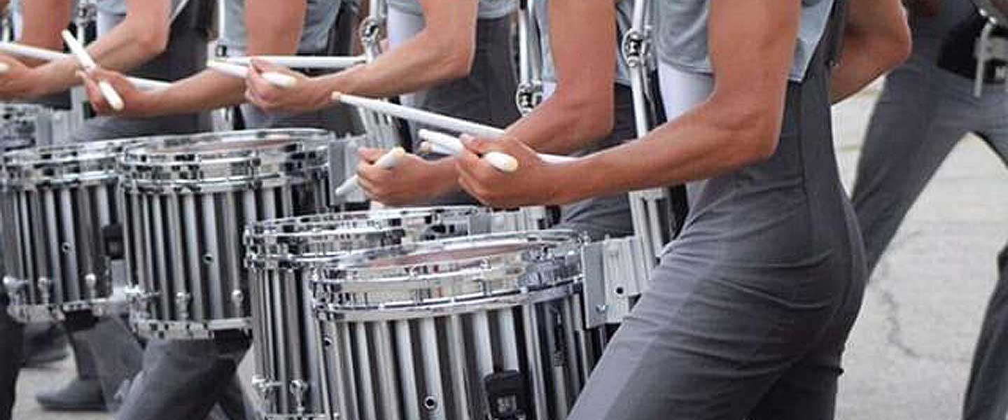 Sam Fleming '19 drumming in the Carolina Crown Drum Corps