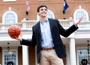 Basketball player, Gui Guimaraes '18 in front of Bortz Library