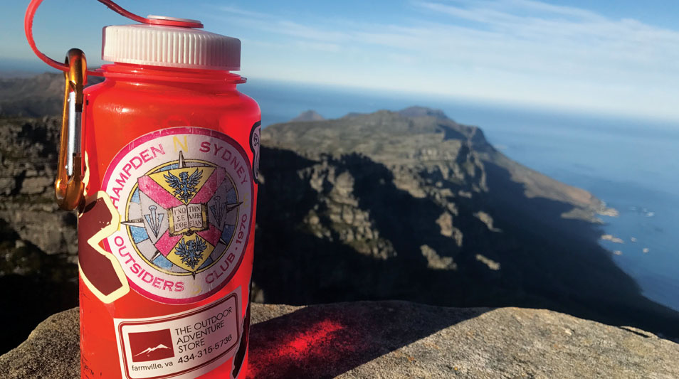 Tillmon Cook's water bottle overlooking the coast of Africa