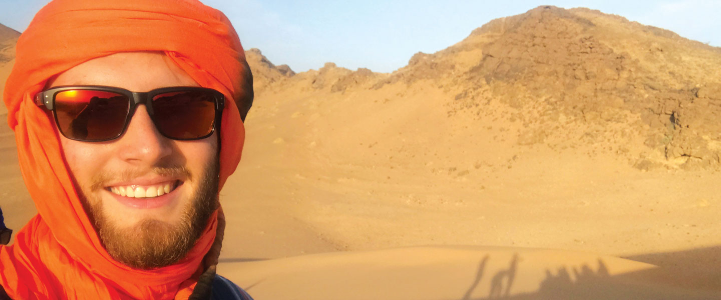 Tillman Cook '18 in a desert in Morocco while studying abroad