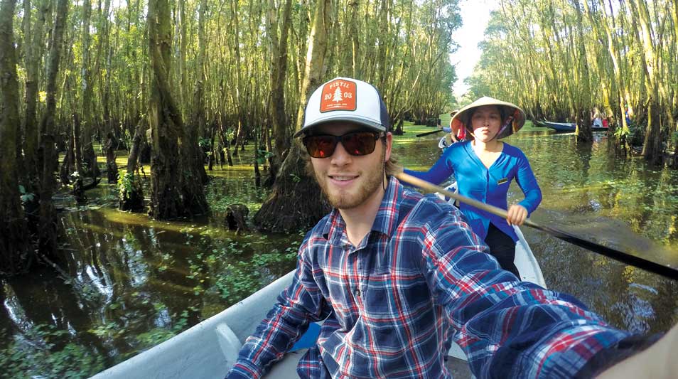 Tillmon Cook aboard a boat in Cambodia