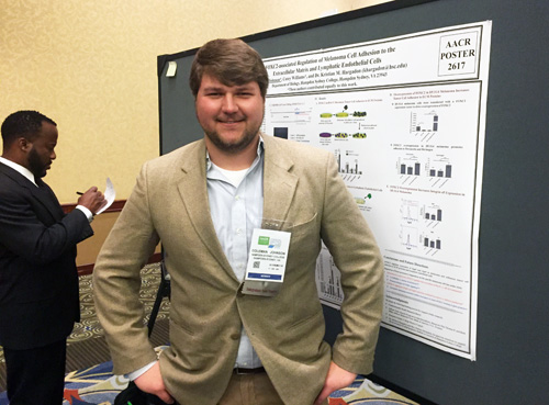 Coleman Johnson '19 in front of his research poster