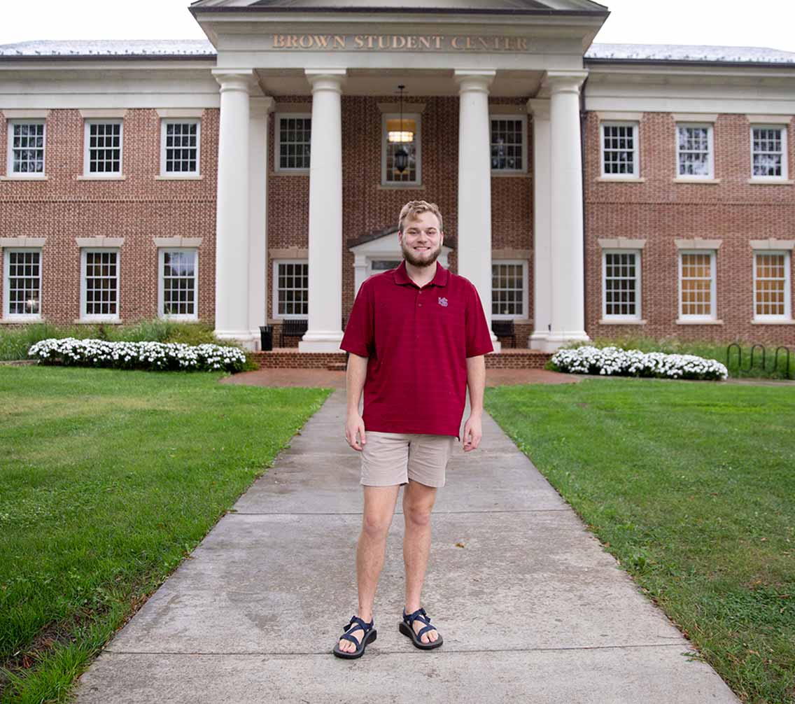 Harrison Whaley '21 standing in front of Brown Student Center