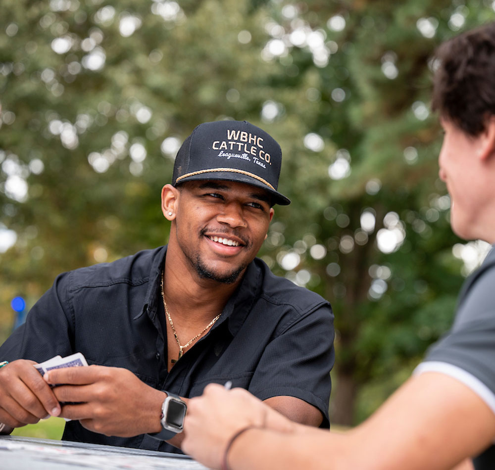 Kaleb Smith '22 playing cards with friends