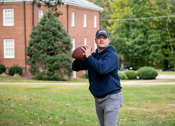 Peter Orgain '22 about to throw a football