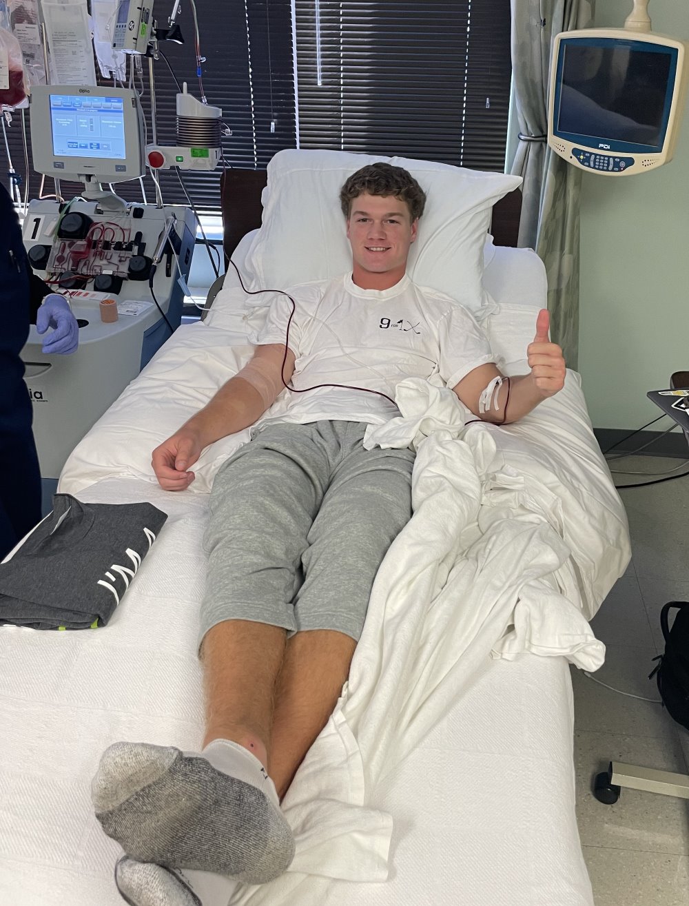 Peyton Lambert laying in a hospital bed