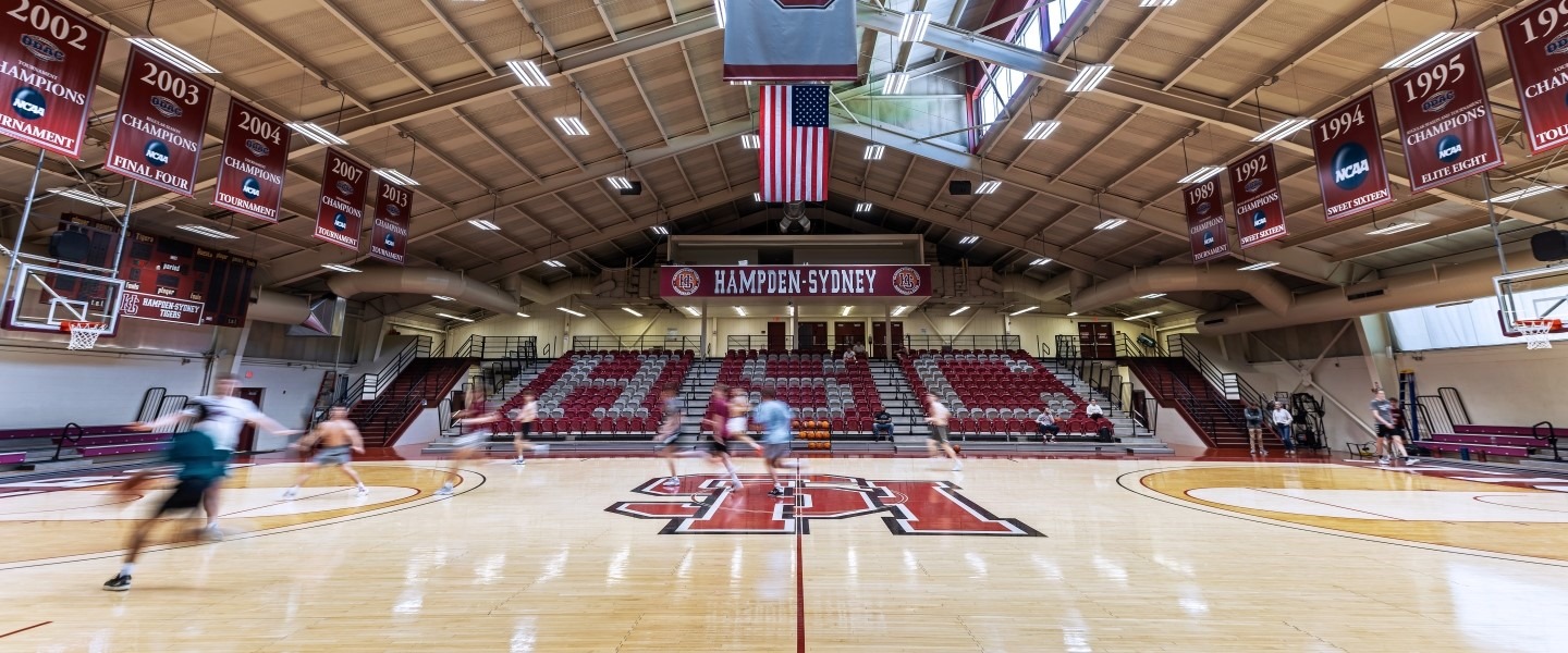  a view of the basketball court with students playing a pickup game