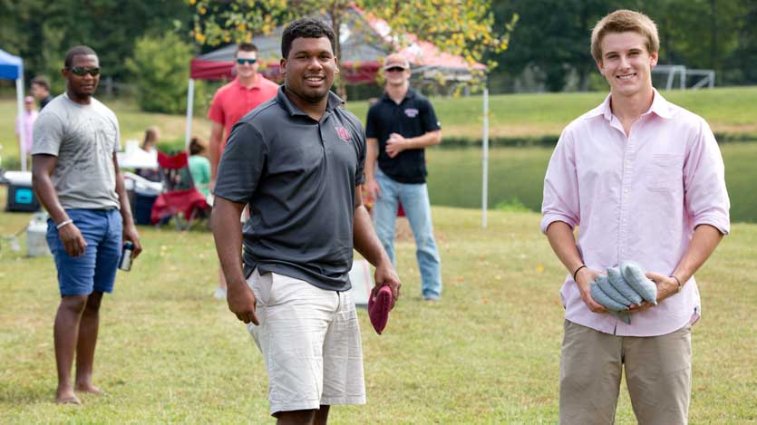 Students playing corn hole at Hampden-Sydney College