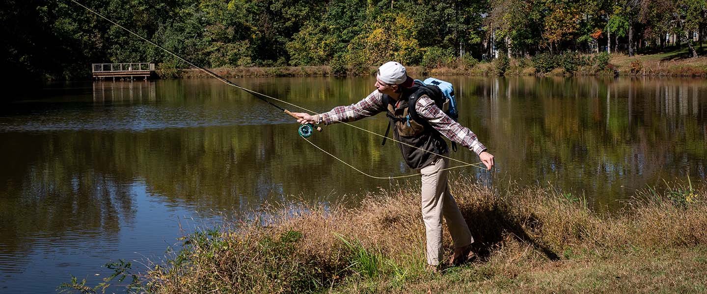 Student fishing at the Hampden-Sydney College Chalgrove Pond