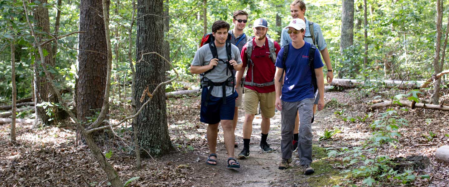 A group of young men hiking on the Wilson Trail at Hampden-Sydney College