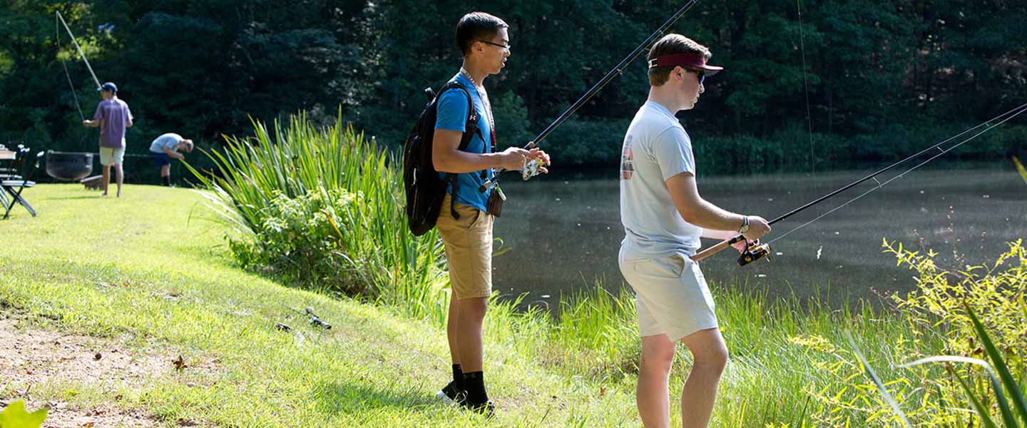 Students fishing at Chalgrove Pond at Hampden-Sydney College