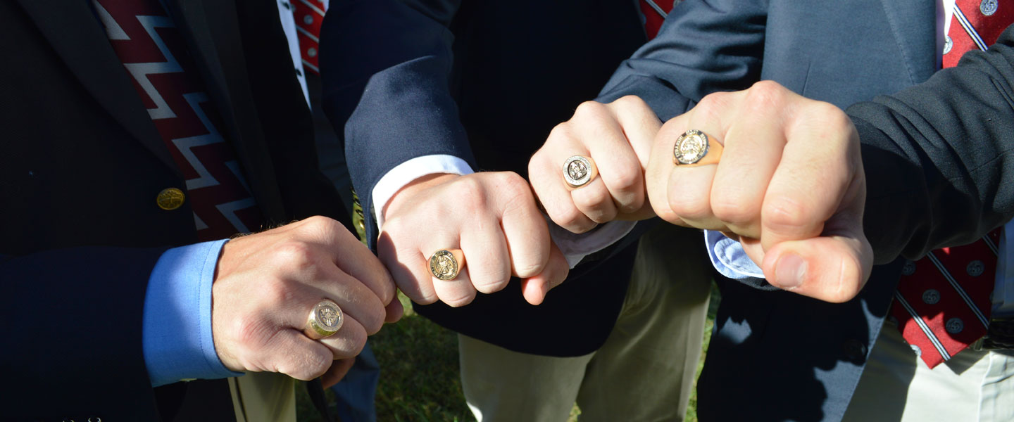 Hampden-Sydney College brothers showing off their class rings.