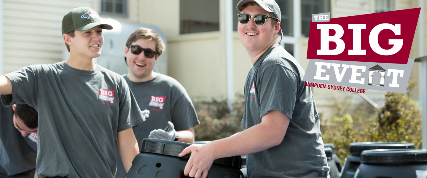 Hampden-Sydney students moving rain barrels with logo of "The Big Event" in the corner