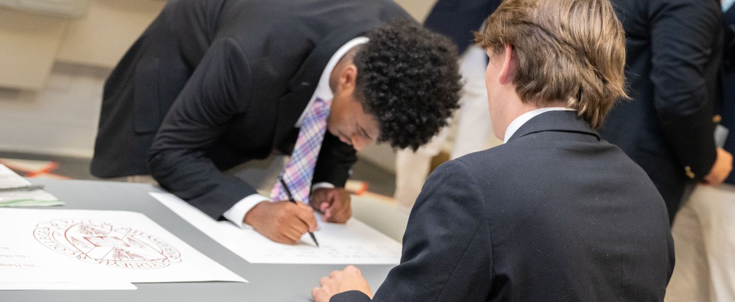 Hampden-Sydney College students signing the honor pledge