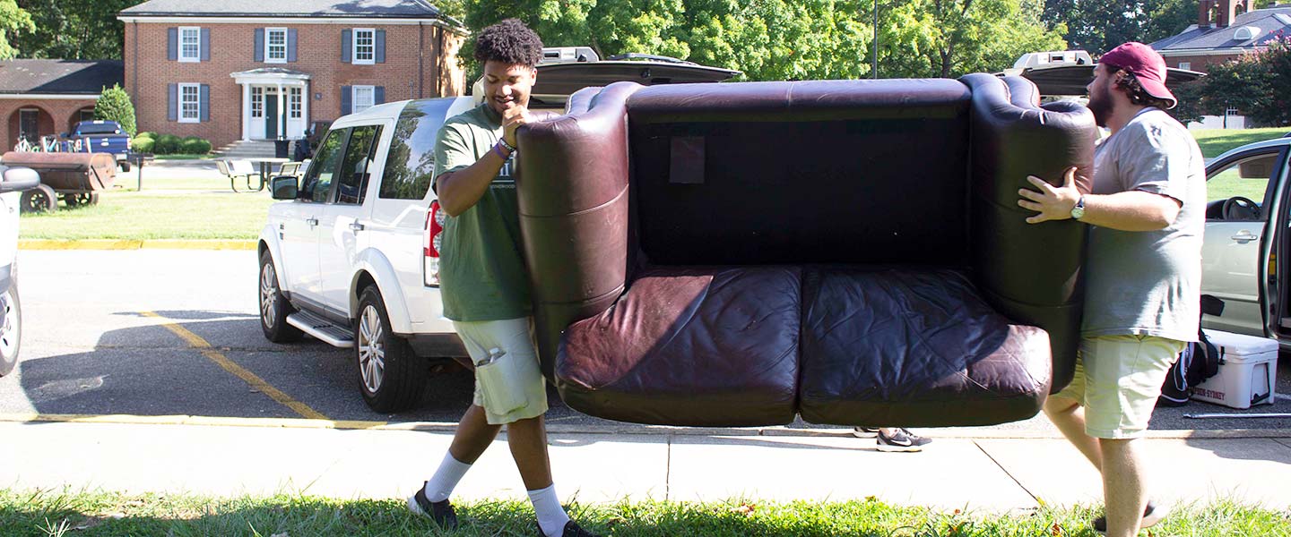 Students unloading cars and moving furniture on move-in day at Hampden-Sydney College