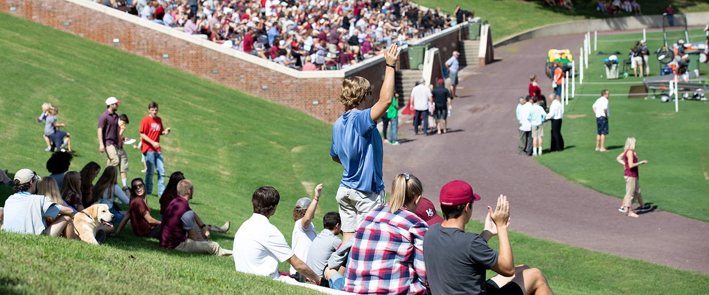 Crowd and people cheering on the hill at a Hampden-Sydney College football game
